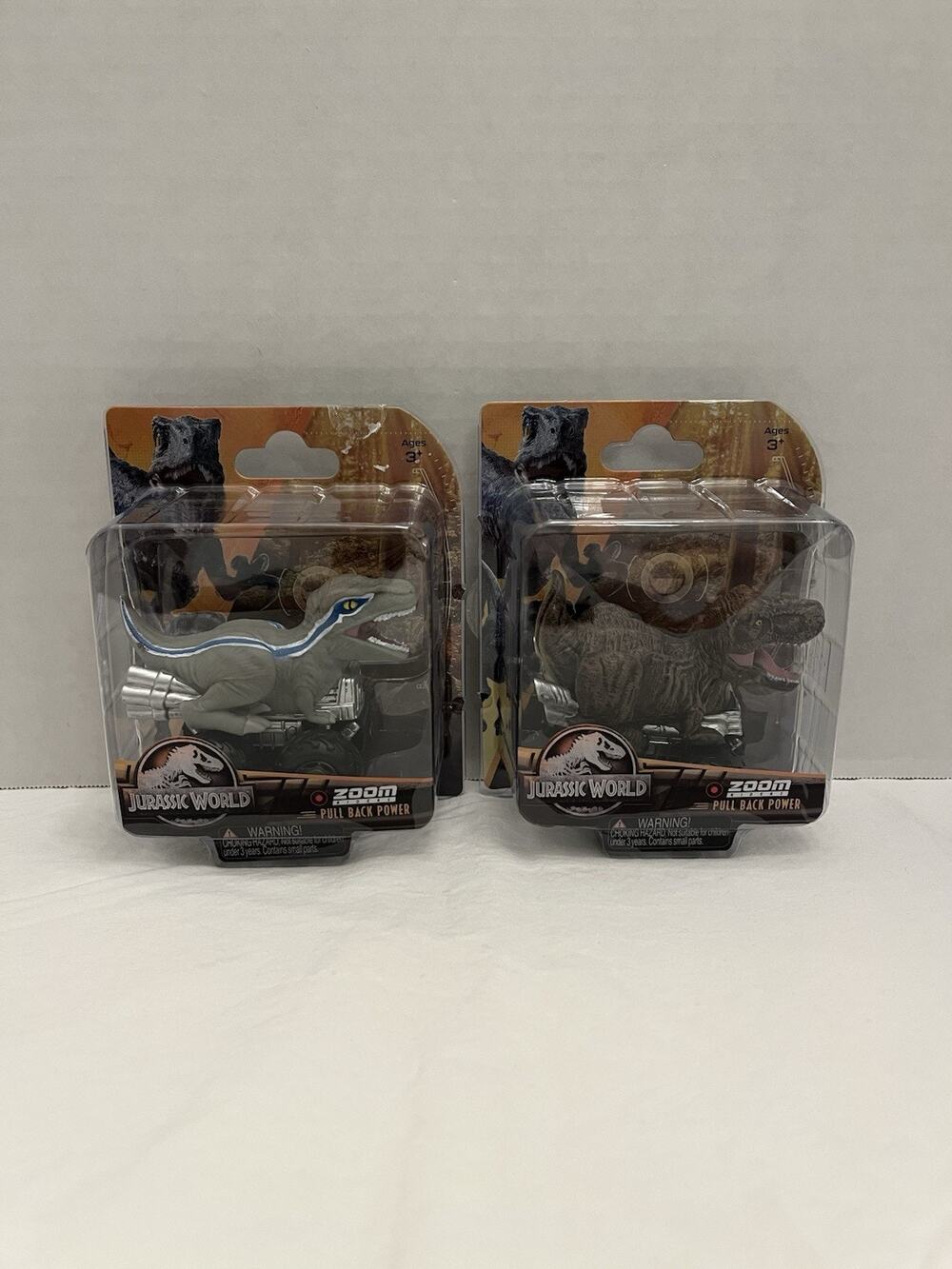 Lot Of 2 Jurassic World Zoom Riders Pullback Power Dinosaur Cars Blue & T-Rex